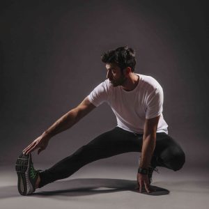 man-exercising-dark-background